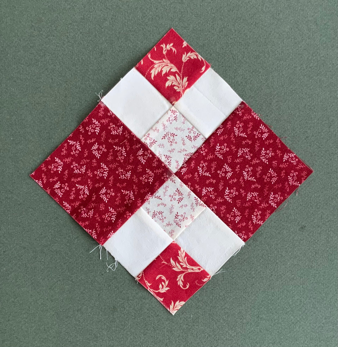 Autumn Tints quilt block made of red and white fabric